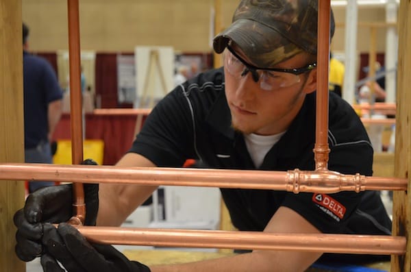Tyler Arndt, representing Arndt & Sons Plumbing, Brooklyn, WI, works hard during the plumbing apprenticeship contest.