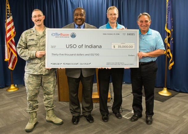 Tom Huntington, WaterFurnace president and CEO, presented the check during an Oct. 23 news conference at the company’s corporate headquarters in Fort Wayne, Ind. From left to right: Col. Patrick Renwick, Wing Commander, 122nd ANG; James Pridgen, President & CEO, USO of Indiana; Carl Huber, VP of Corporate Quality, WaterFurnace International; Tom Huntington, President & CEO, WaterFurnace International.