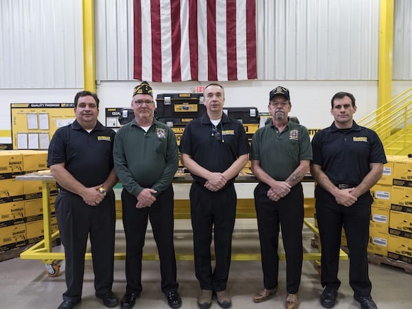 Members of the Greenfield VFW accept a donation of tools from DEWALT